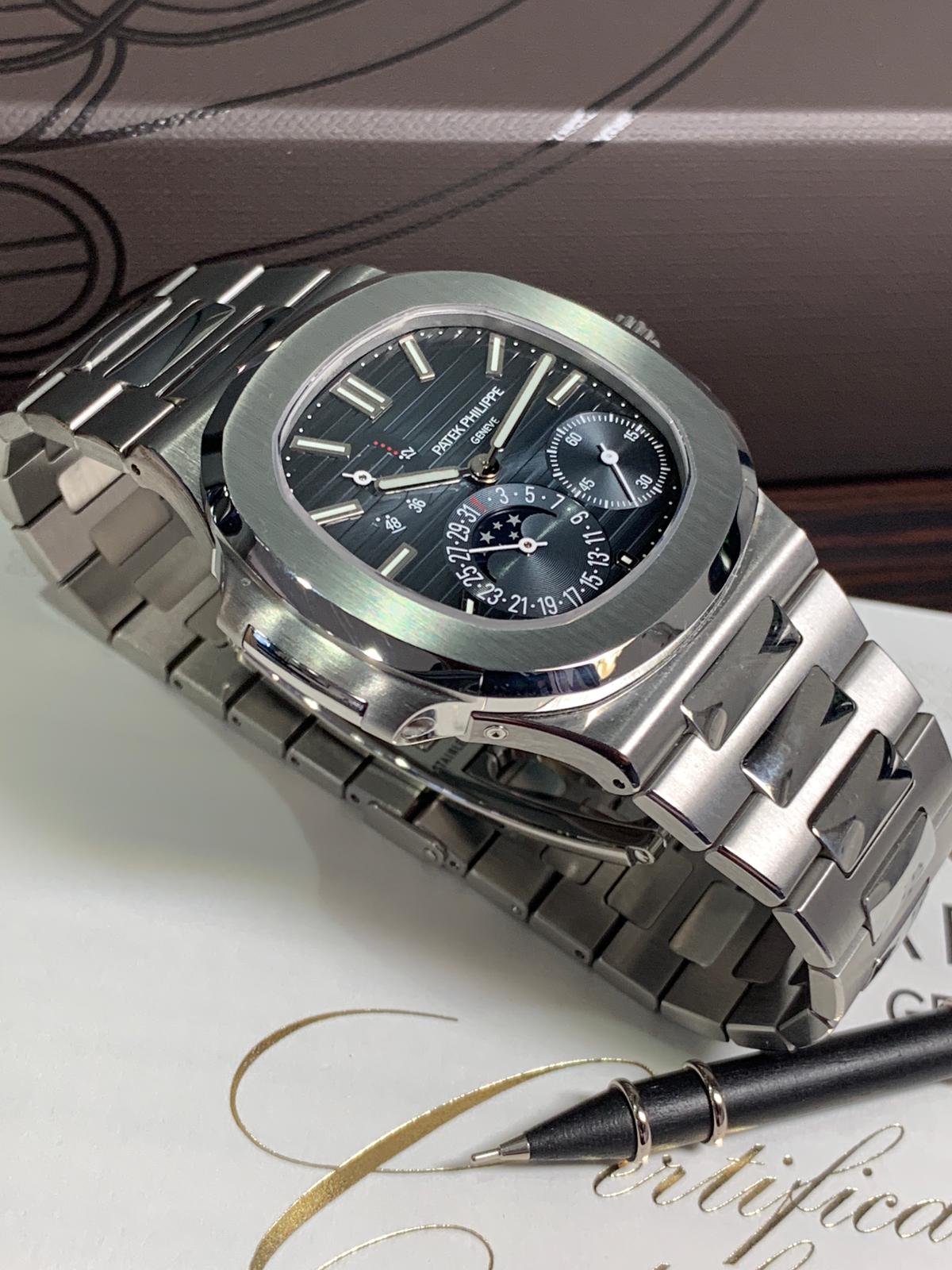 A PATEK PHILIPPE NAUTILUS BLUE DIAL MOONPHASE 5712/1a - Carr Watches