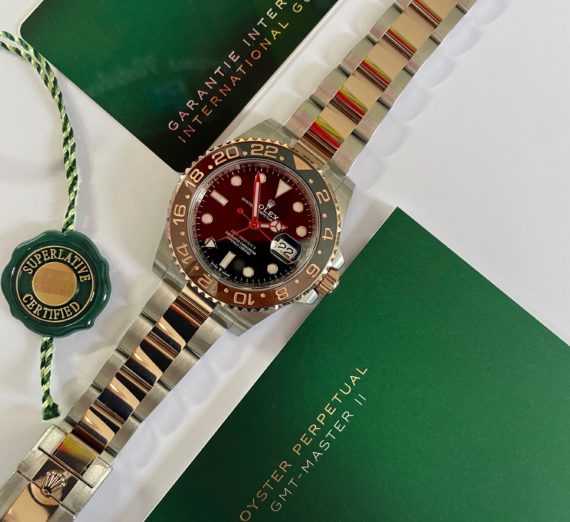 A 2021 ROLEX GMT MASTER  IN 18CT ROSE GOLD AND STEEL 8